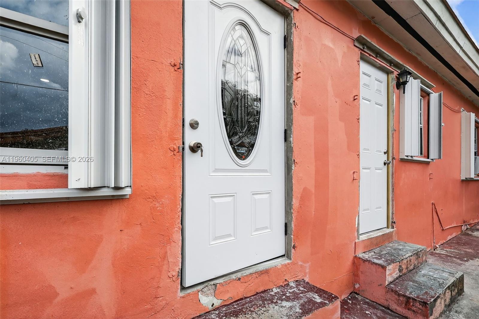 280 Northwest 34th Street Miami, FL 33127 - Photo 33 of 34 a view of a livingroom with wooden floor and a large window
