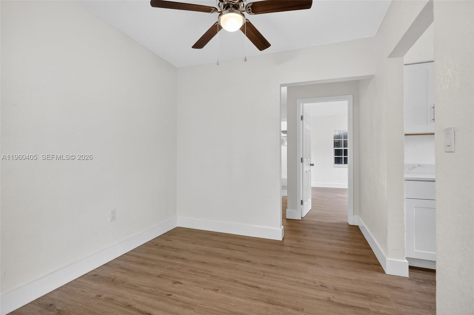 280 Northwest 34th Street Miami, FL 33127 - Photo 7 of 34 a view of empty room with wooden floor