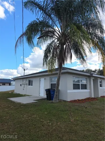 a front view of house with yard and seating area