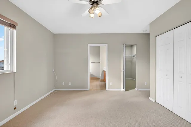 a bathroom with a granite countertop sink mirror and bathtub