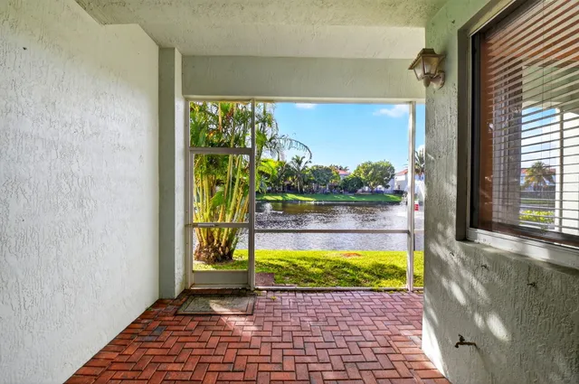 a view of a lake with a house in the background