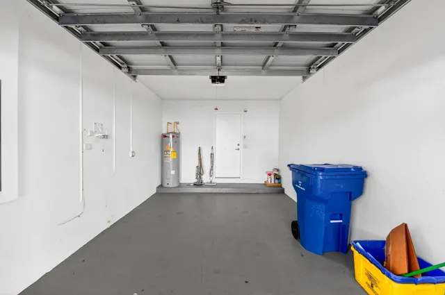 an aerial view of residential houses with outdoor space and swimming pool