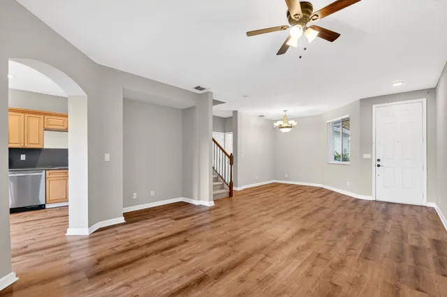 a kitchen with stainless steel appliances a refrigerator sink and microwave