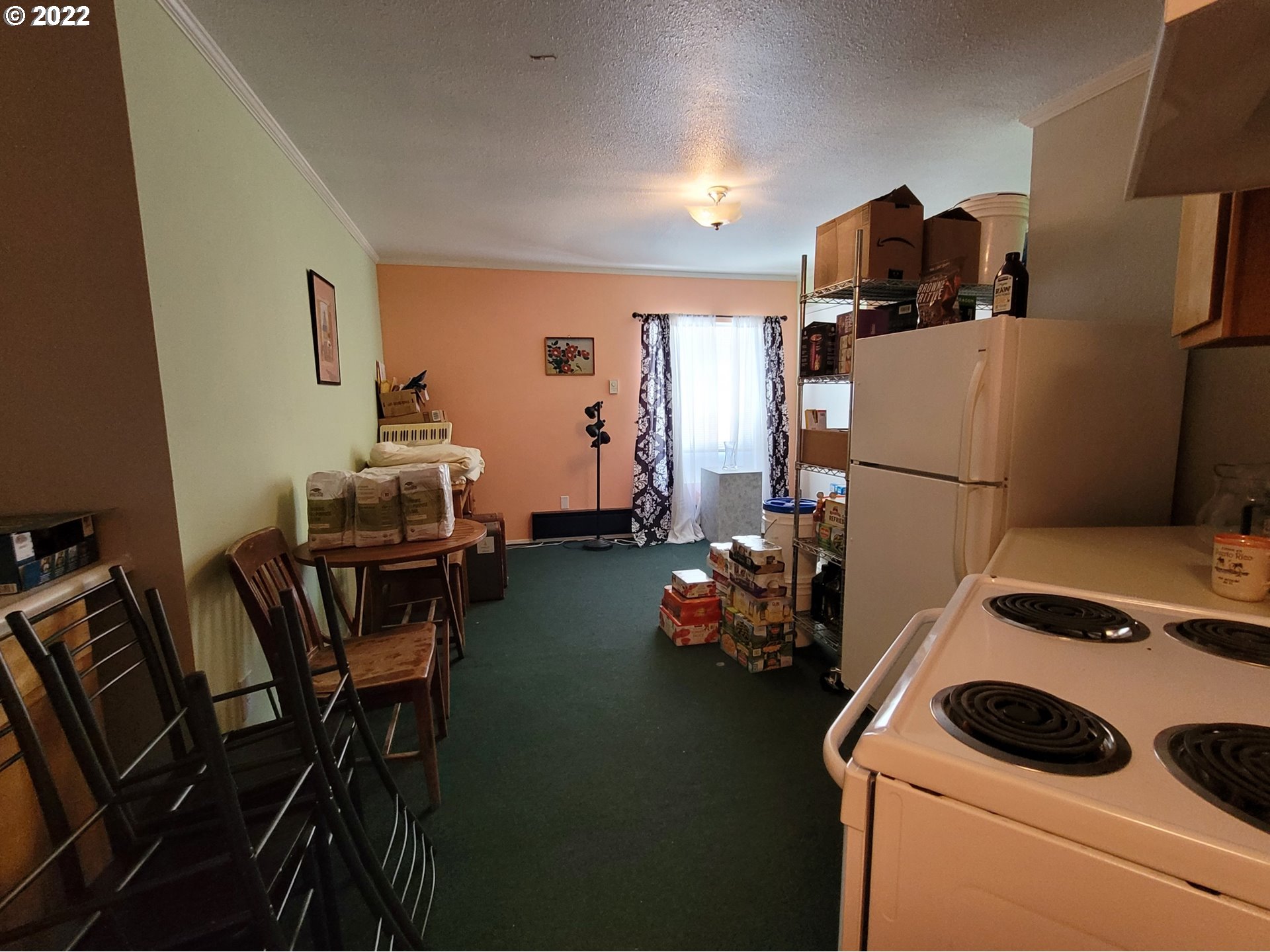 246 6th Street Port Orford, OR 97465 - Photo 12 of 34 a room with furniture and a table