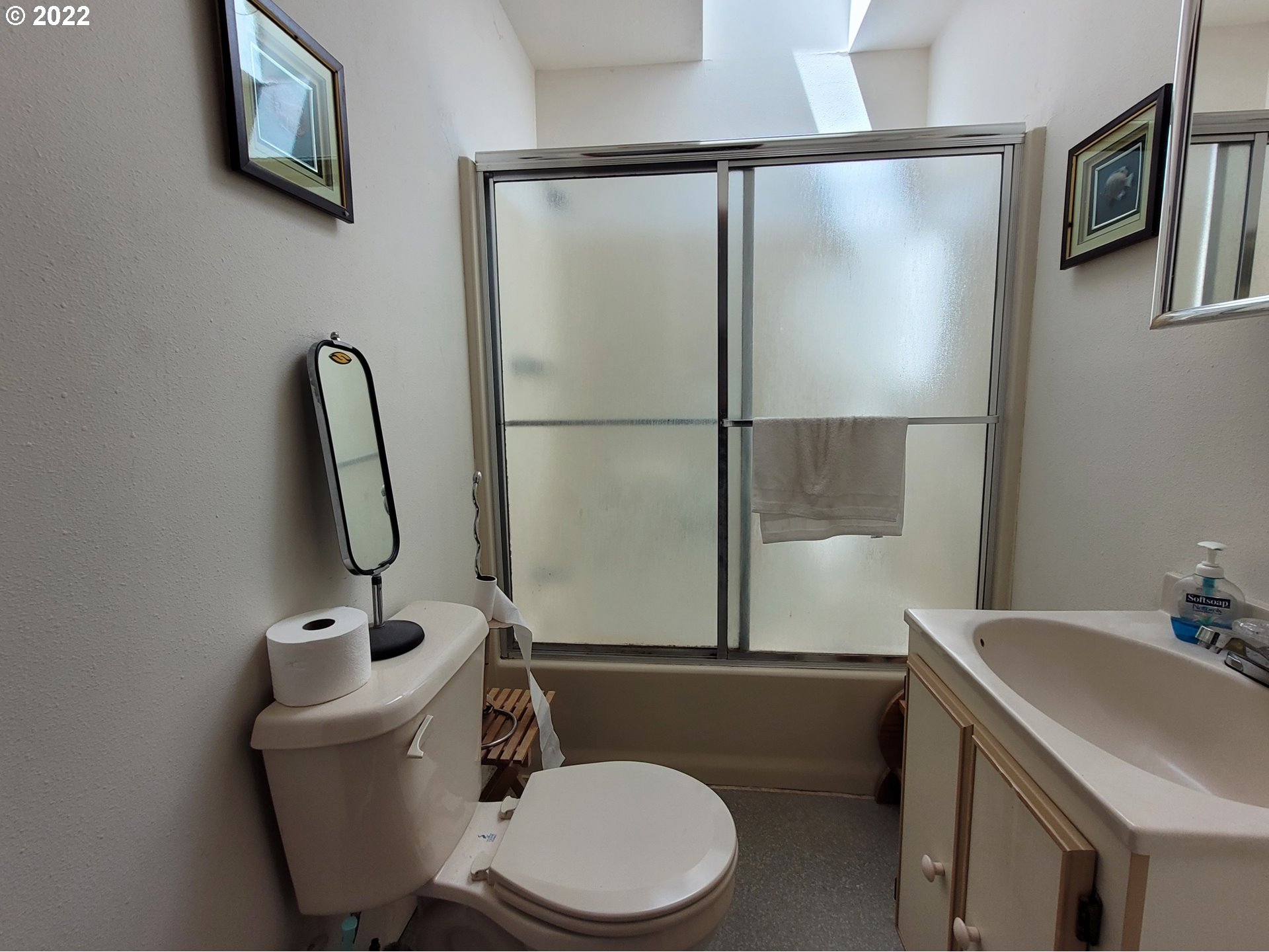 246 6th Street Port Orford, OR 97465 - Photo 14 of 34 a bathroom with a sink toilet and shower