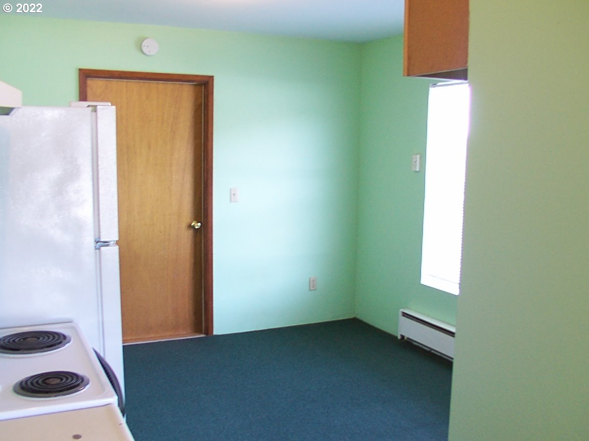 246 6th Street Port Orford, OR 97465 - Photo 16 of 34 a view of an empty room with a window
