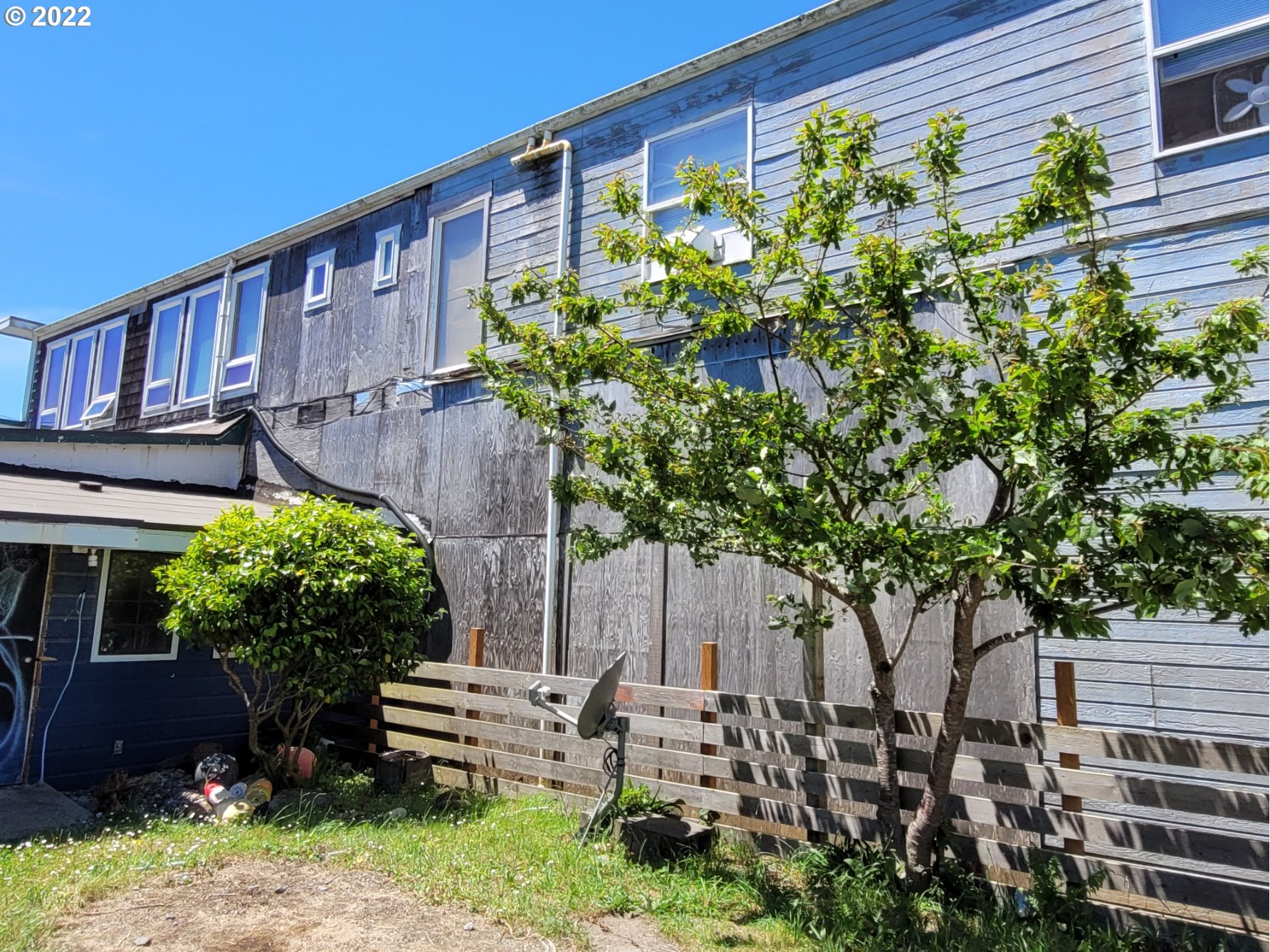 246 6th Street Port Orford, OR 97465 - Photo 25 of 34 a backyard of a house with lots of green space