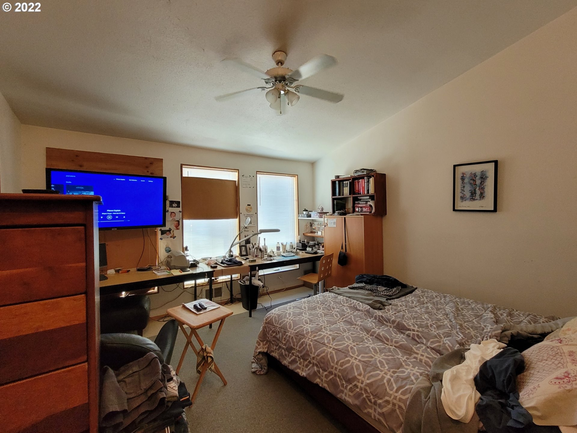 246 6th Street Port Orford, OR 97465 - Photo 6 of 34 a bedroom with a bed and wooden floor