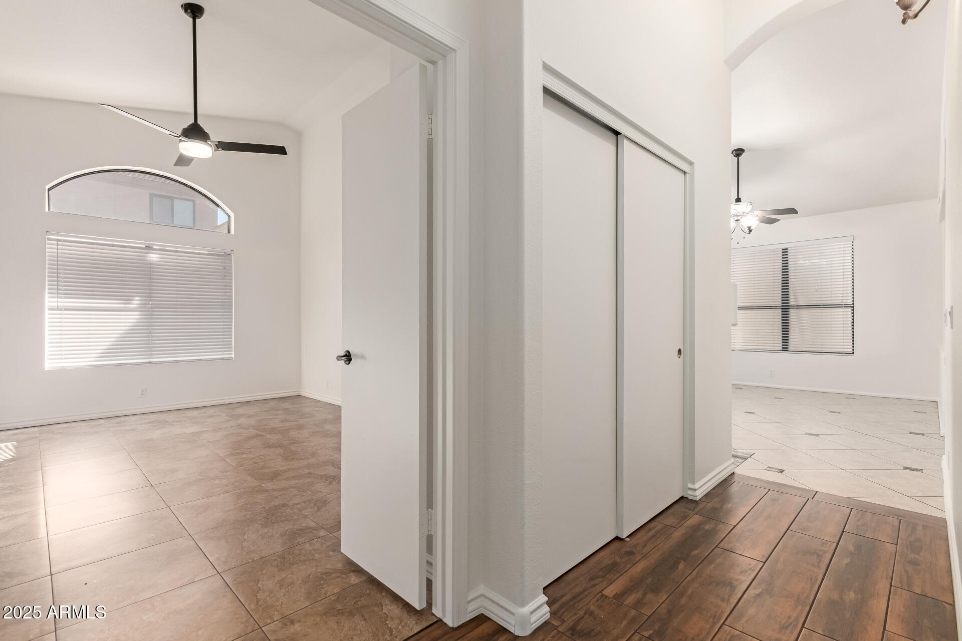 2107 East Marco Polo Road Phoenix, AZ 85024 - Photo 13 of 36 a view of a livingroom with wooden floor and a bathroom space