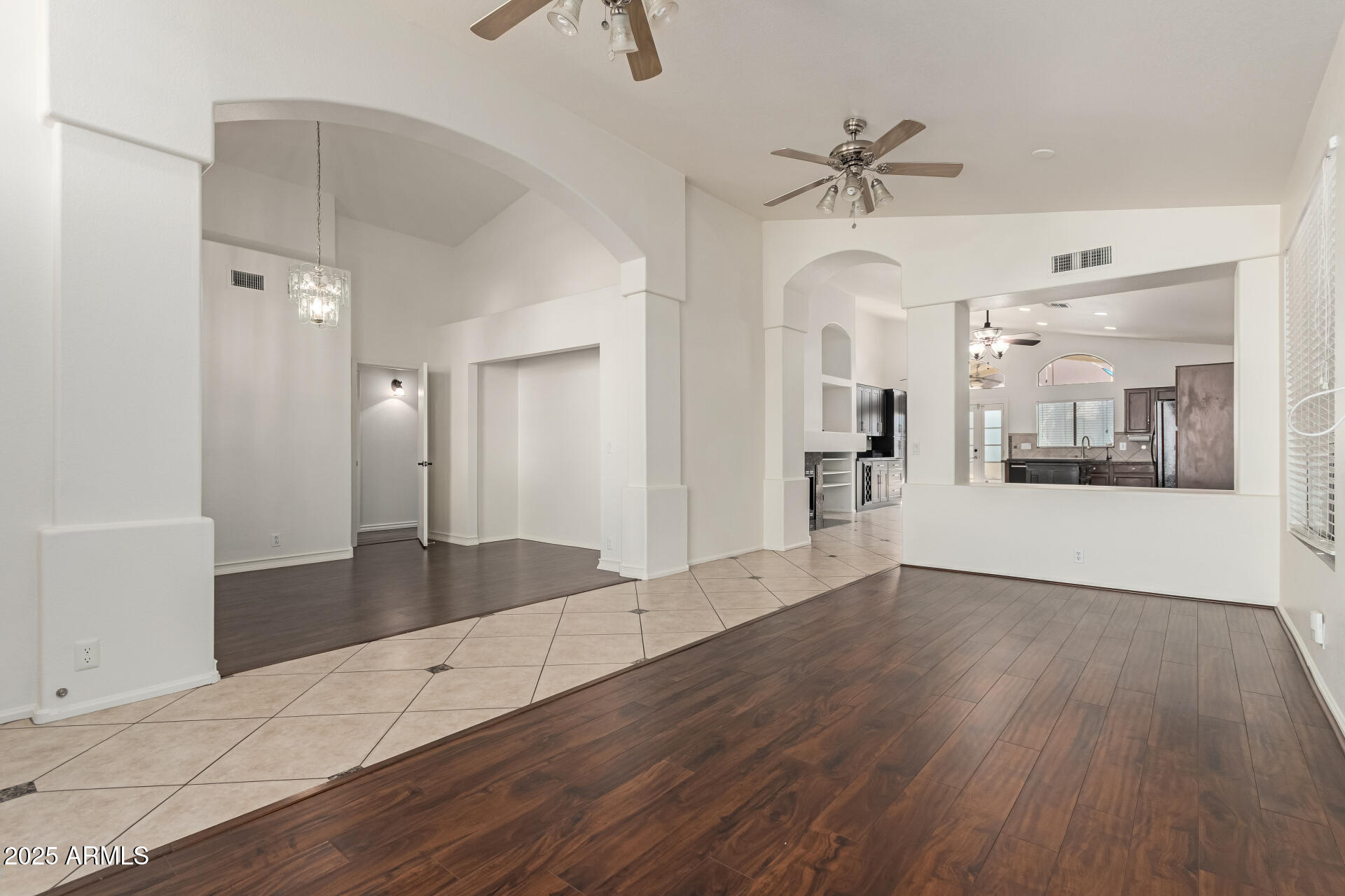 2107 East Marco Polo Road Phoenix, AZ 85024 - Photo 2 of 36 a view of a hallway with wooden floor and a cabinet
