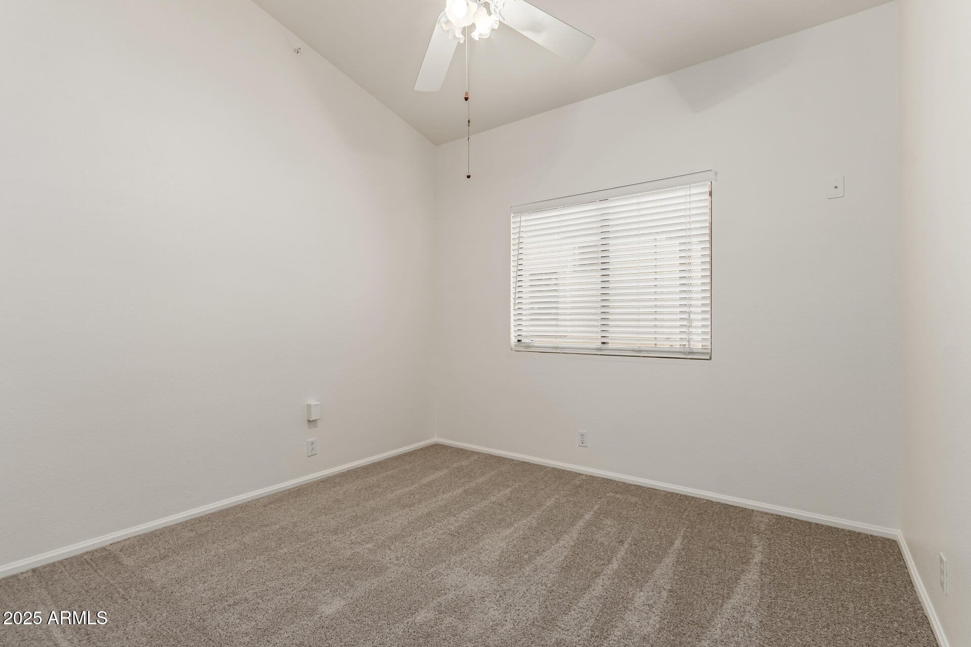 2107 East Marco Polo Road Phoenix, AZ 85024 - Photo 22 of 36 an empty room with a window