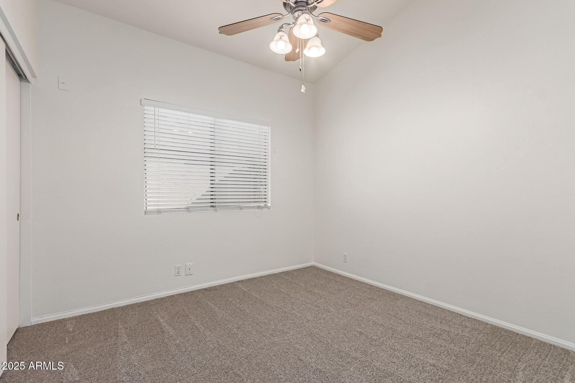 2107 East Marco Polo Road Phoenix, AZ 85024 - Photo 24 of 36 an empty room with a window