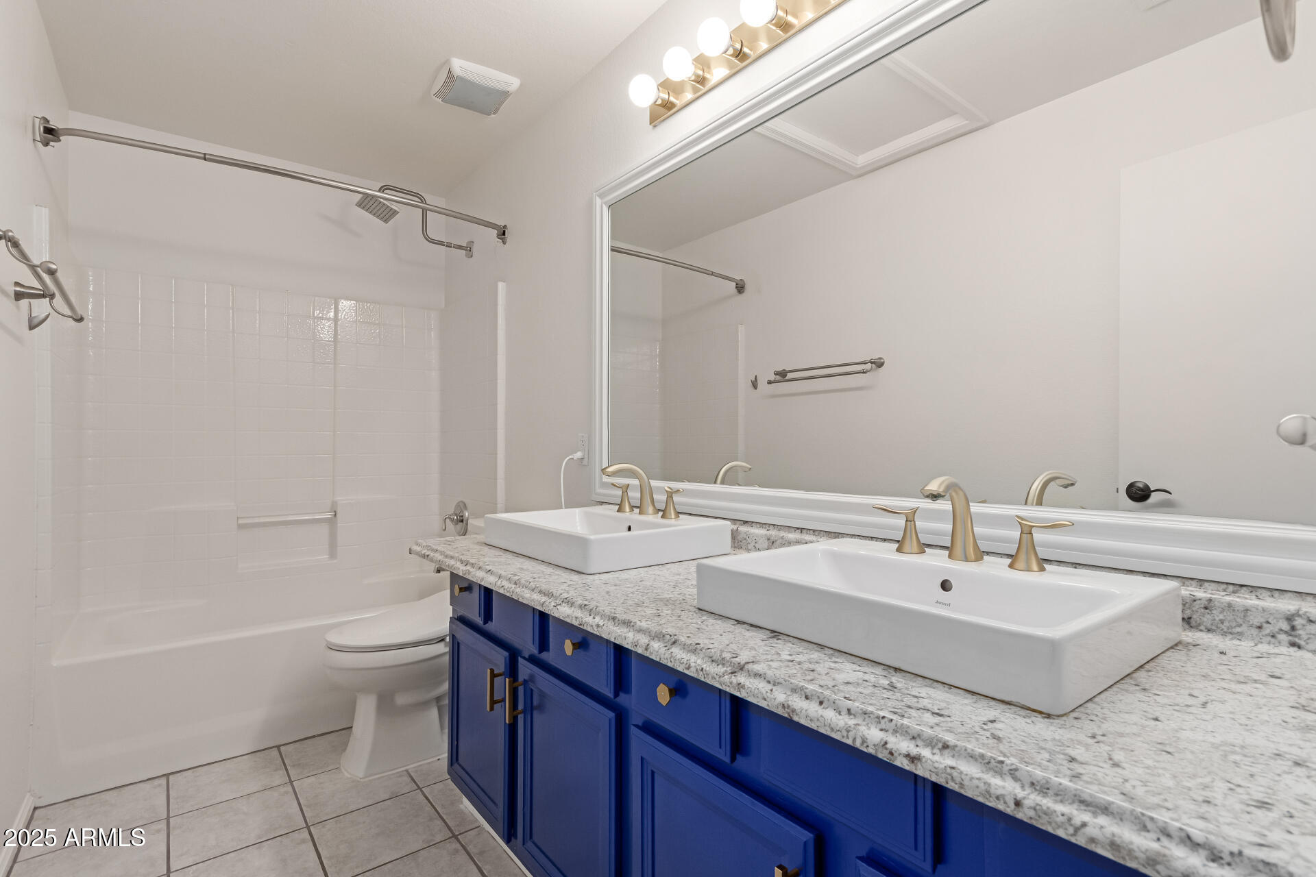 2107 East Marco Polo Road Phoenix, AZ 85024 - Photo 26 of 36 a bathroom with a granite countertop sink a toilet and bathtub