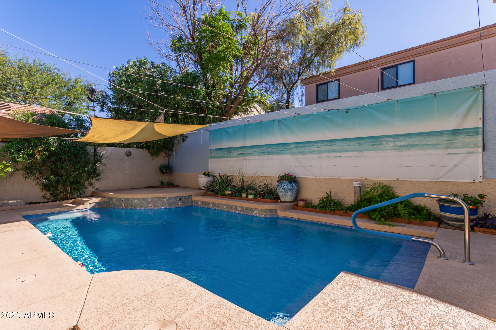 2107 East Marco Polo Road Phoenix, AZ 85024 - Photo 30 of 36 a view of a backyard with plants and a patio