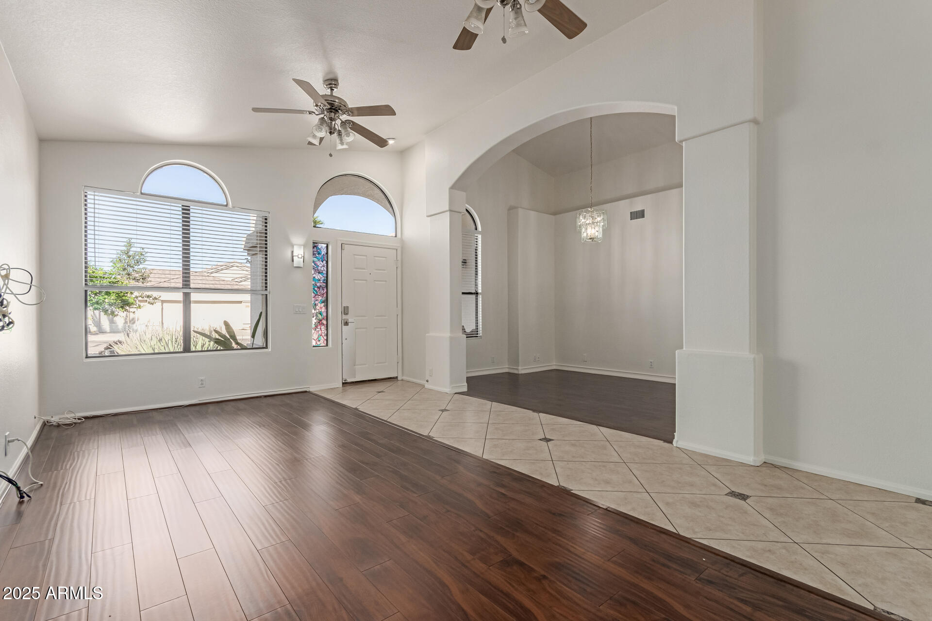2107 East Marco Polo Road Phoenix, AZ 85024 - Photo 3 of 36 wooden floor in an empty room with a window