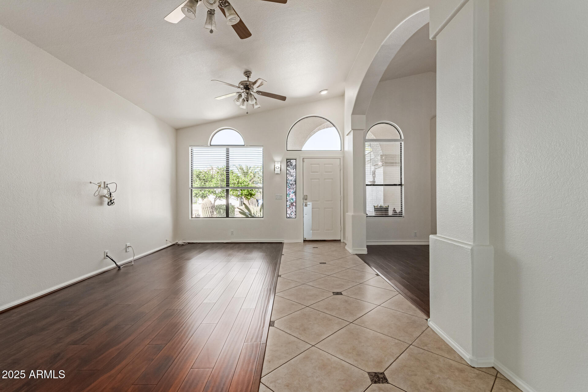 2107 East Marco Polo Road Phoenix, AZ 85024 - Photo 4 of 36 wooden floor in an empty room with a window