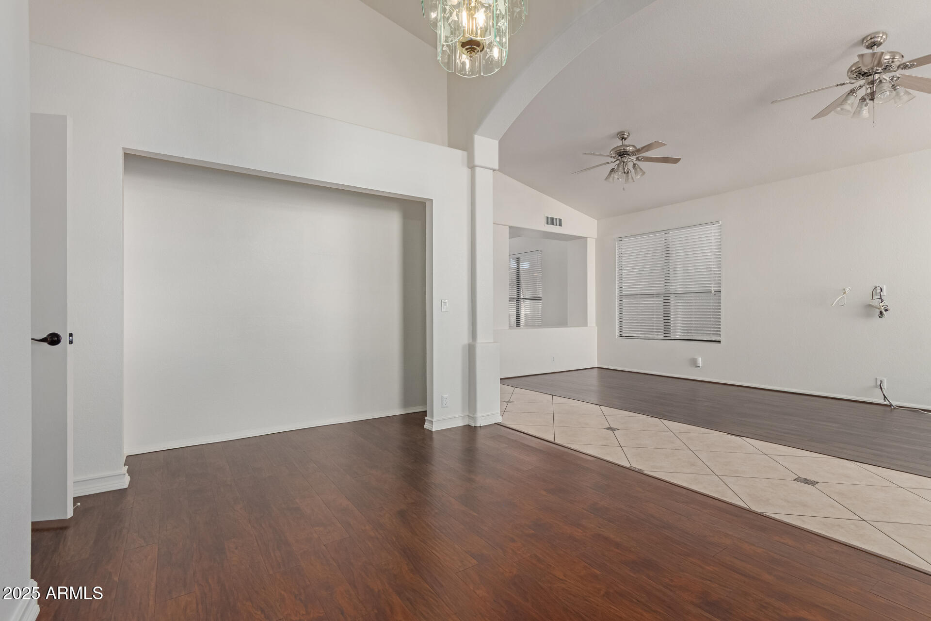 2107 East Marco Polo Road Phoenix, AZ 85024 - Photo 5 of 36 a view of a room with wooden floors and ceiling fan