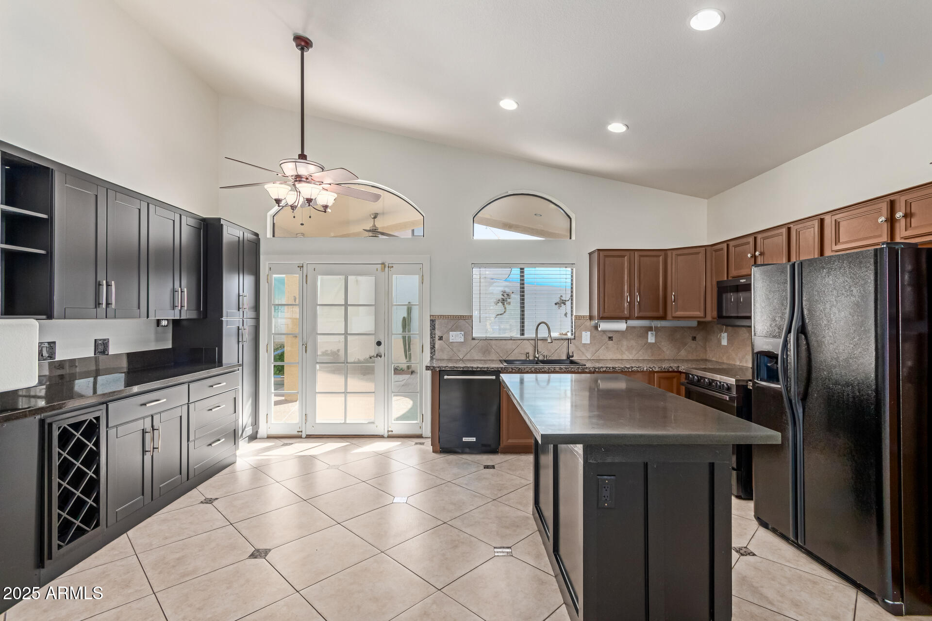 2107 East Marco Polo Road Phoenix, AZ 85024 - Photo 9 of 36 a kitchen with stainless steel appliances granite countertop a sink refrigerator and cabinets