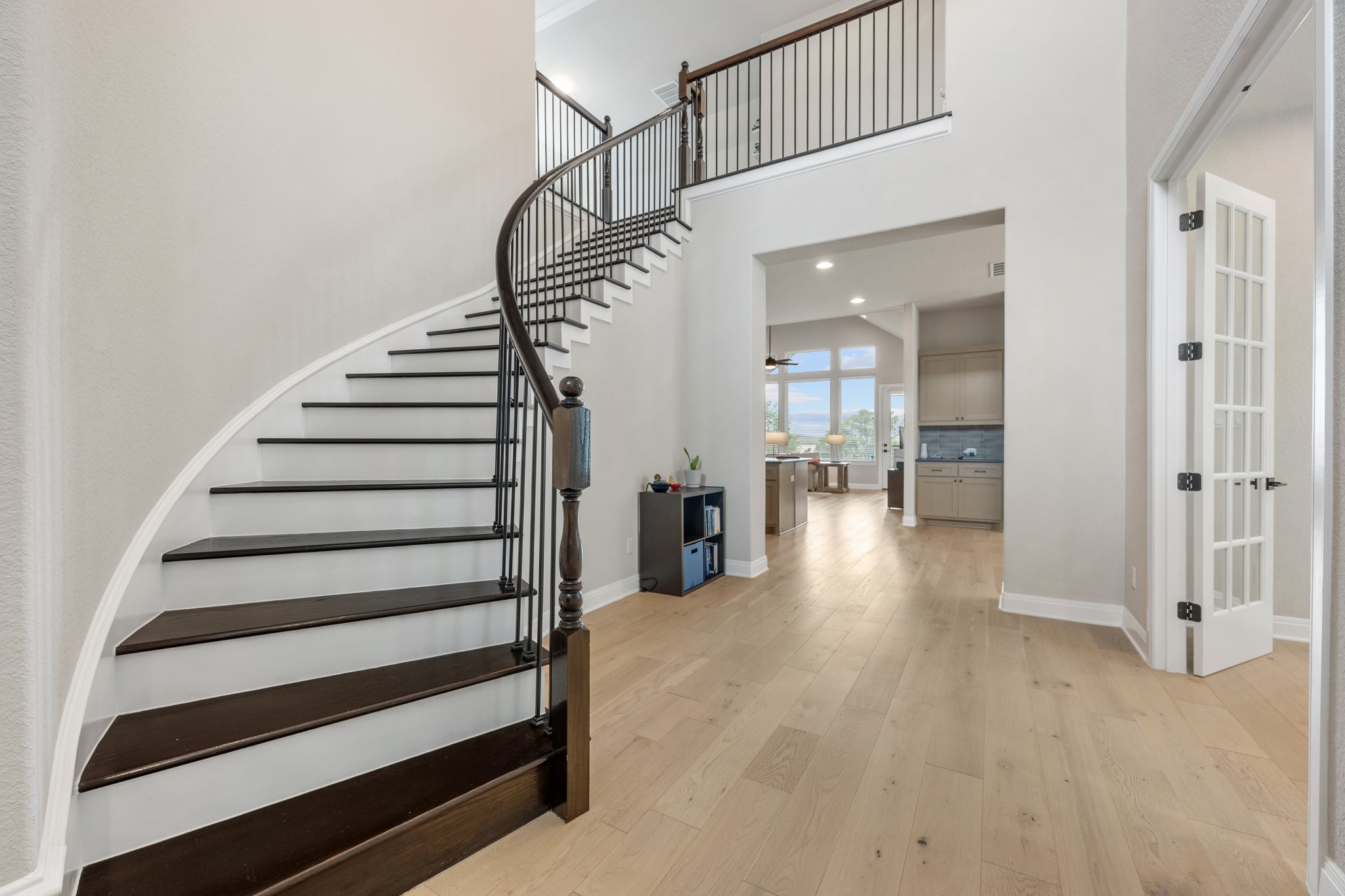 510 Elworth Path Austin, TX 78738 - Photo 17 of 40 a view of a hallway with wooden floor and entryway