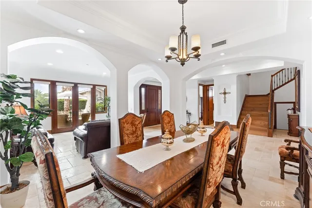 a living room with furniture and white walls