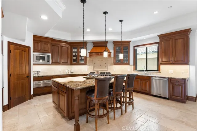 a bedroom with a bed dresser and wooden floor