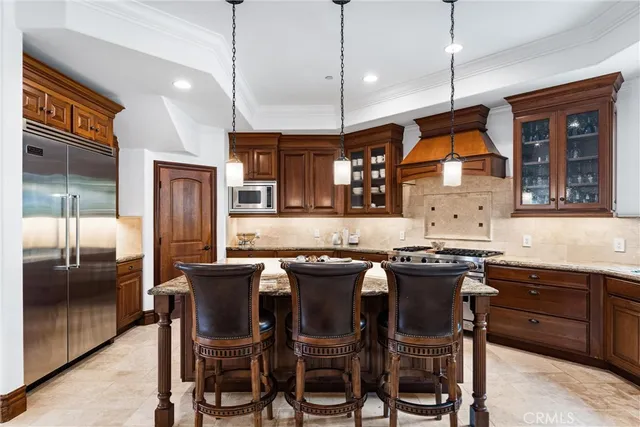 a balcony with furniture and a potted plant