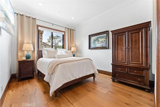 a view of a swimming pool with a table and chairs under an umbrella