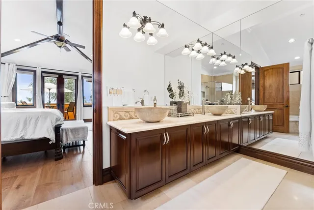 a bedroom with a bed lamp and window