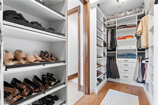 a living room with furniture and large windows