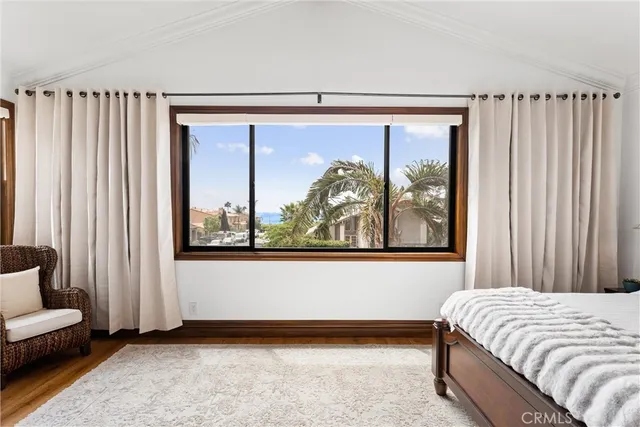 a view of a patio with table and chairs and potted plants