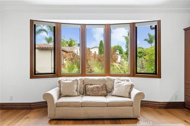 a view of a patio with a table and chairs and potted plants