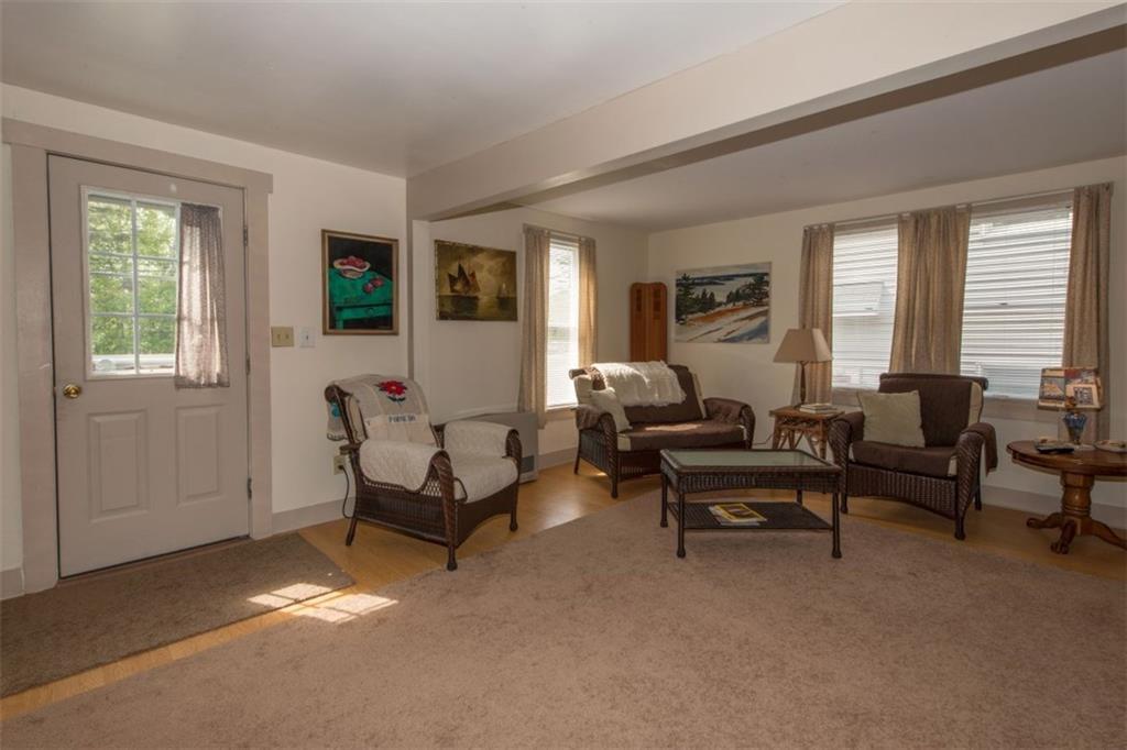684 Wiscasset Road Boothbay, ME 04537 - Photo 8 of 26 The living room with pellet stove...
