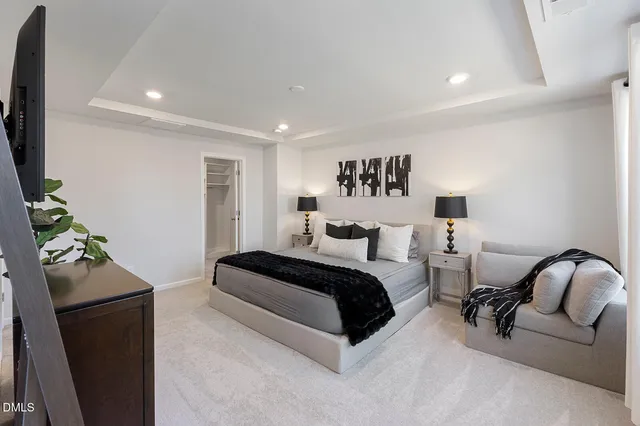 a bedroom with bed and a couch