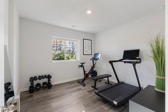 a work room with furniture and wooden floor
