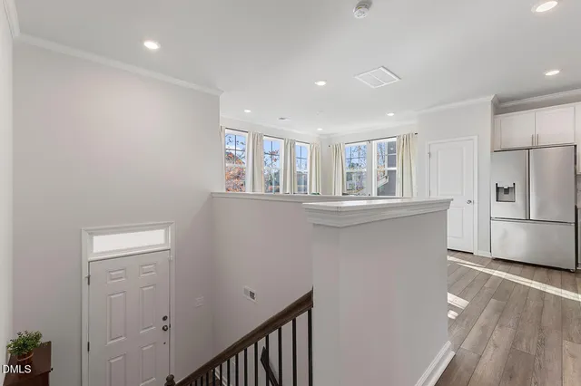 a kitchen with stainless steel appliances a refrigerator and a stove