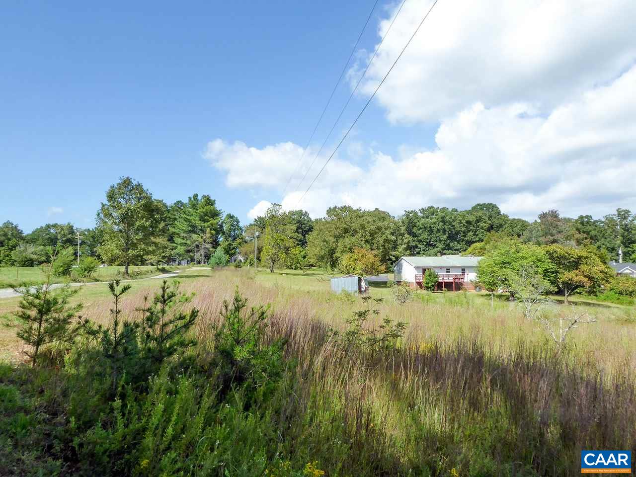 2656 Dunnes Shop Road Ruckersville, VA 22968 - Photo 2 of 27 a view of a lake with houses in the back