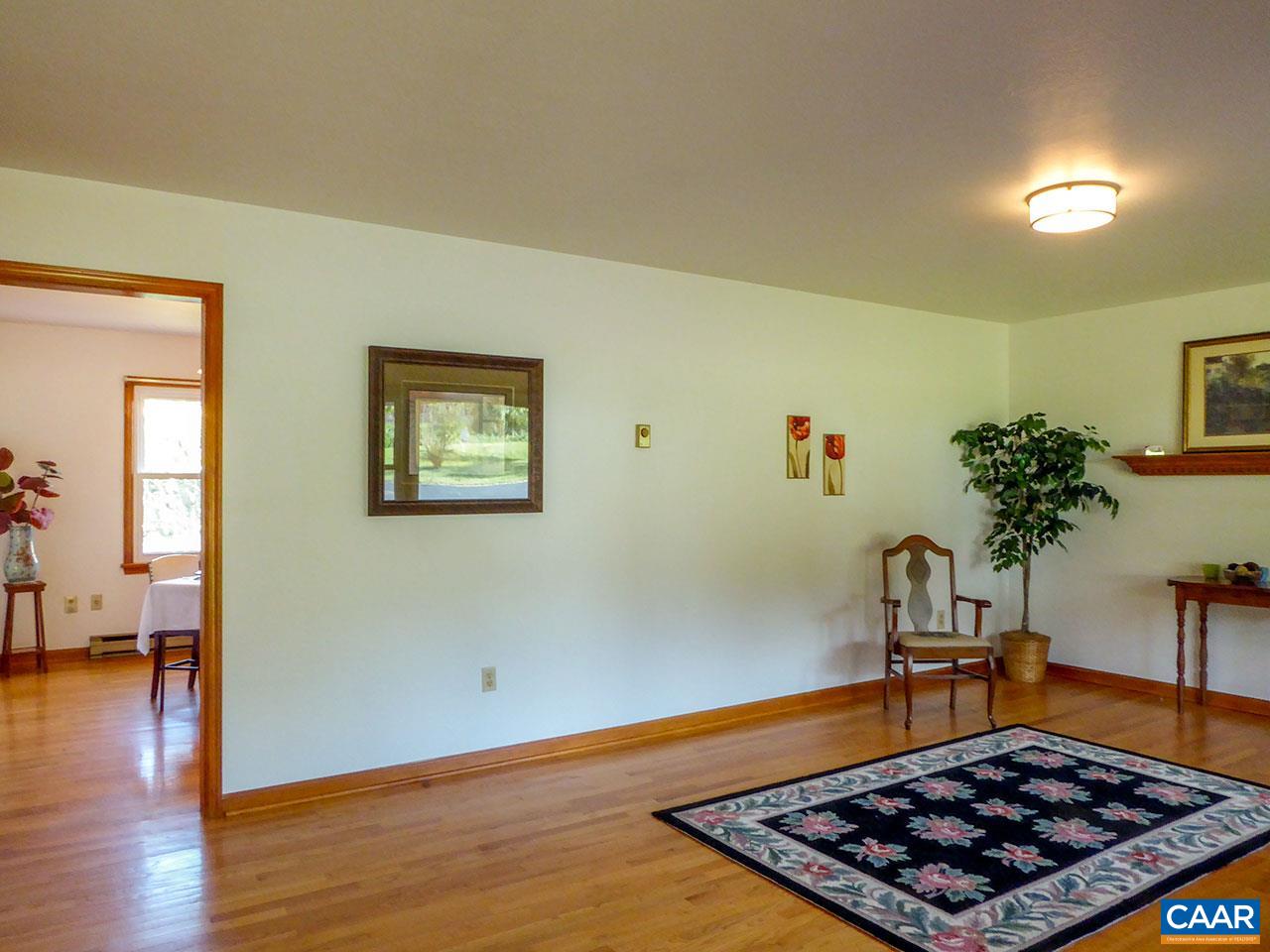 2656 Dunnes Shop Road Ruckersville, VA 22968 - Photo 5 of 27 a room with wooden floor and potted plant