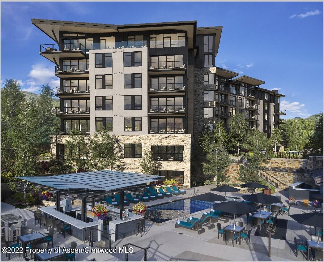 130 Wood Road, Unit 261263 Snowmass Village, CO 81615 - Photo 7 of 7 a view of building with outdoor seating space