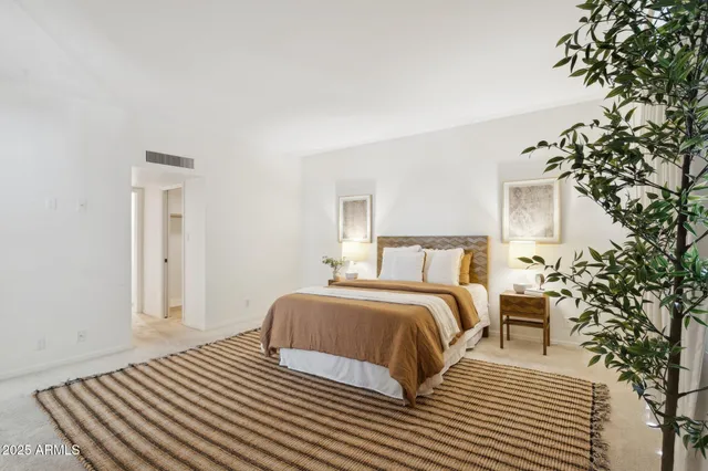 a bathroom with a double vanity sink mirror and bathtub