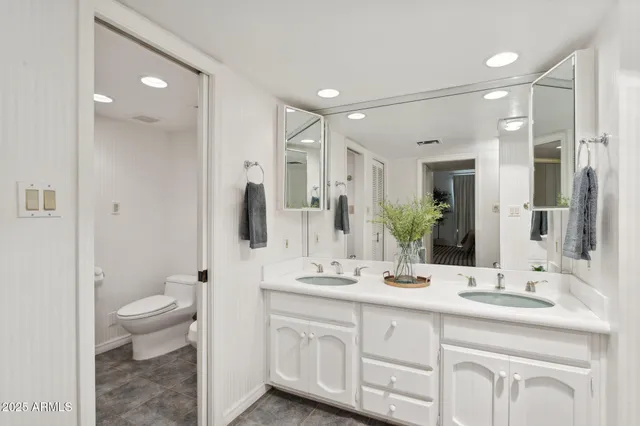 a bathroom with a shower and a sink