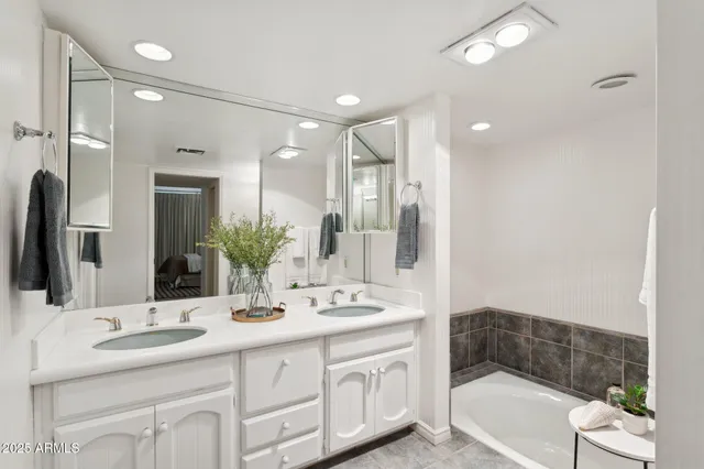 a white toilet sitting next to a bathroom sink