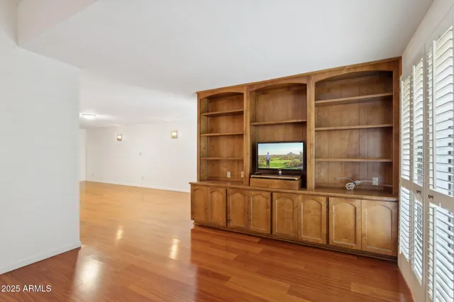 a white toilet sitting next to a shower curtain