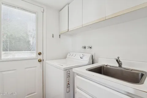 a view of a bathtub in back yard of the house