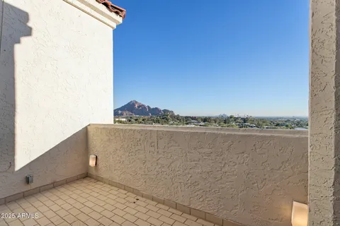 a view of balcony with floor to ceiling window and wooden floor