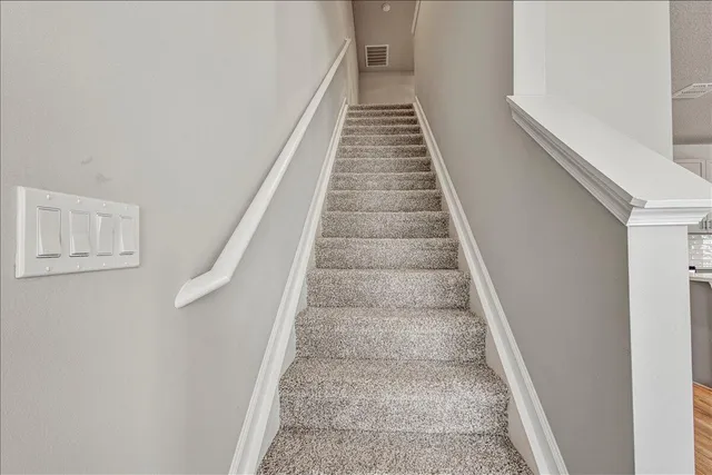 an empty room with a empty space and windows