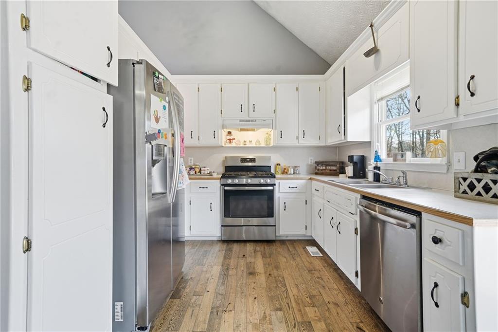 13 Timberline Drive Jasper, GA 30143 - Photo 12 of 39 a kitchen with cabinets stainless steel appliances and a counter space