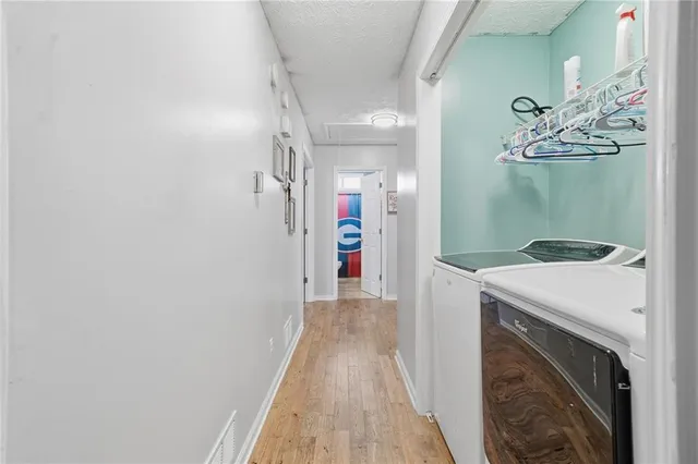 a bedroom with furniture a bed and a chandelier