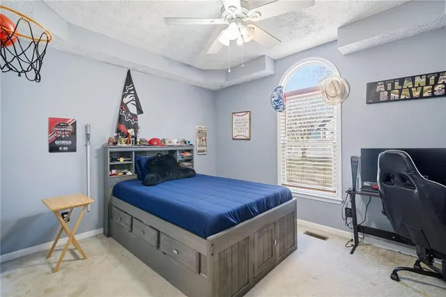 a bedroom with a workspace