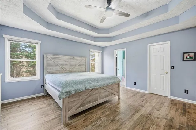a bathroom with a sink vanity mirror and toilet