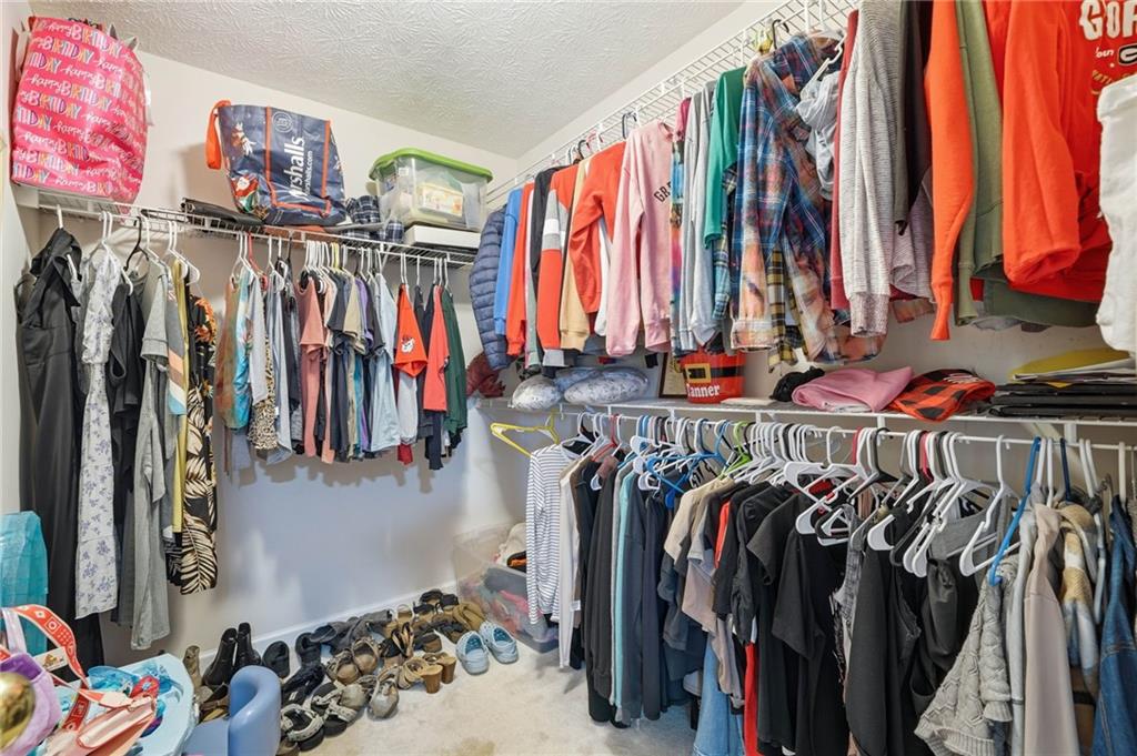13 Timberline Drive Jasper, GA 30143 - Photo 26 of 39 a view of walk in closet with clothes and shoes